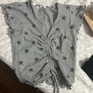 Antistar Grey Dressy Shirt with string adjusting stomach and had stars on it!